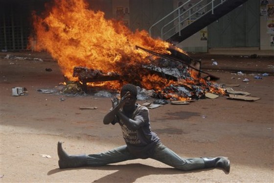 Army troops and police faced off against rioting demonstrators in downtown Kampala on Friday, the first time the growing protest movement had reached the country's capital.
